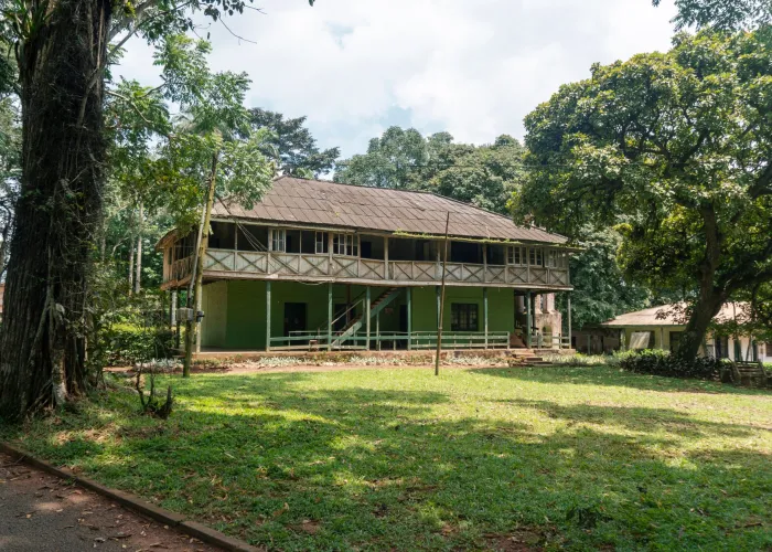 A charming colonial-era house with lush greenery in Eastern Region, Ghana.