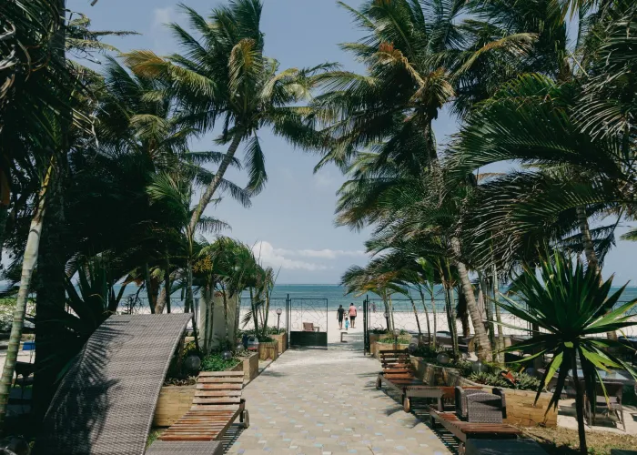 Relax at a tropical beachfront paradise in Mombasa, Kenya.